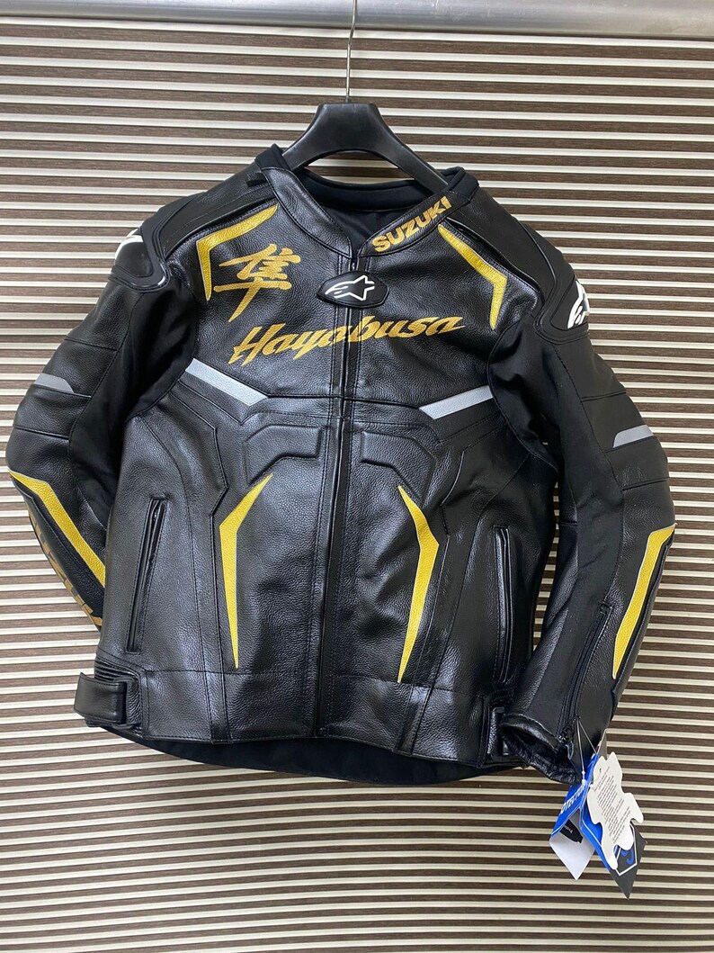 May include: Black leather motorcycle jacket with yellow accents and the text "Suzuki Hayabusa" in gold lettering.