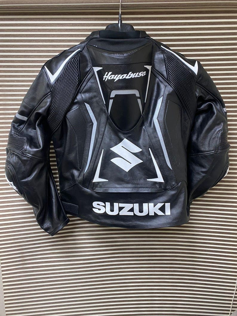 May include: Black leather motorcycle jacket with white accents and the words "Hayabusa" and "SUZUKI" on the back.