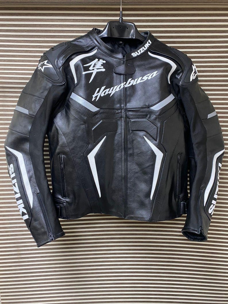 May include: Black leather motorcycle jacket with white accents and the text "Suzuki Hayabusa" on the front.