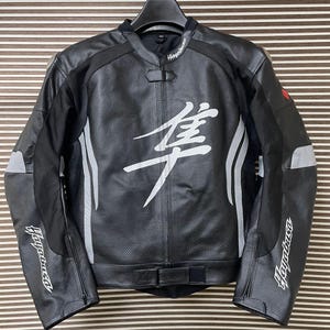 May include: Black leather motorcycle jacket with white accents and the word "Hayabusa" on the sleeves and back. The jacket has a white kanji character on the front.