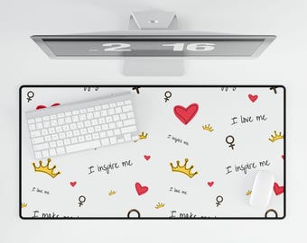 May include: White desk mat with a black border. The mat has a repeating pattern of red hearts, gold crowns, and the text "I love me", "I inspire me", and "I make me".
