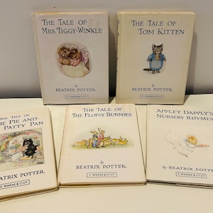 May include: A collection of five vintage Beatrix Potter children's books. Titles include "The Tale of Mrs. Tiggy-Winkle," "The Tale of Tom Kitten," "The Tale of the Pie and the Patty Pan," "The Tale of the Flopsy Bunnies," and "Appley Dapply's Nursery Rhymes." Each book features illustrations and is published by F. Warne & Co.