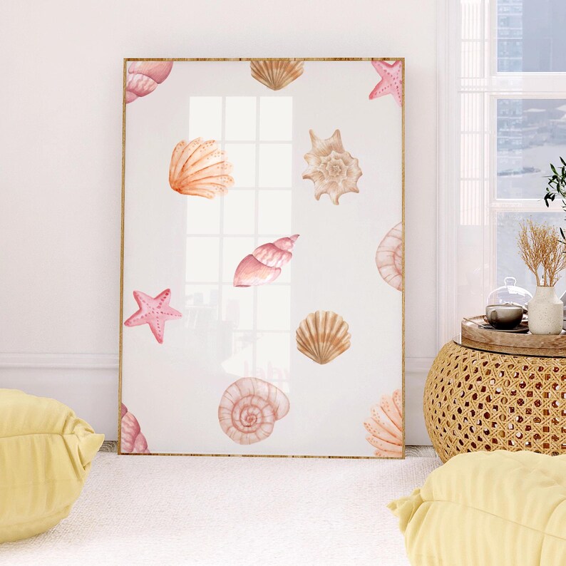 May include: A framed print with a white background and a pattern of pink and orange seashells and starfish.