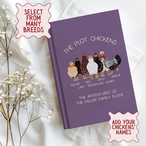 May include: A purple book titled "The Plot Chickens" with illustrations of chickens. The book cover includes the text "Select from Many Breeds" and "Add Your Chickens' Names". The book is on a white surface with floral accents.