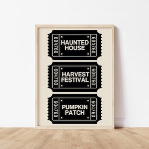 May include: A framed print with three black and white tickets. The tickets display the text "HAUNTED HOUSE", "HARVEST FESTIVAL", and "PUMPKIN PATCH". Each ticket has a unique serial number and star accents, perfect for autumn events.