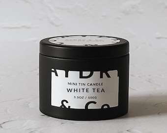 Vela en lata de té blanco: cera de soja y coco con mecha de madera