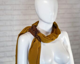 66 by 10 inch old gold lightly geometric scarf with brown lace up holder ring slide buckle pin clip | acrylic polyester | unusual gift