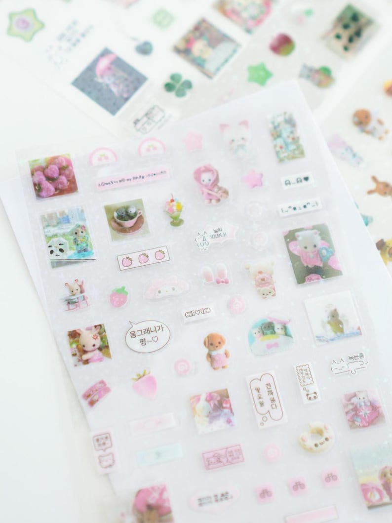 May include: A sheet of clear stickers with a variety of cute illustrations. The stickers feature animals, hearts, strawberries, and other designs. The stickers are perfect for adding a touch of whimsy to your planner, journal, or other projects.