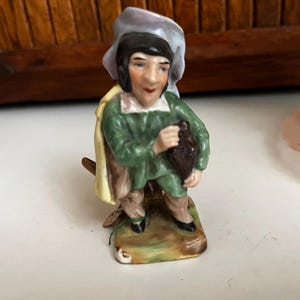 Small Hunchback Holding Bag Instrument Mansion House Dwarf -– XX683 Capodomonte Style Crown over N Mark –Vintage Collectible Figurine