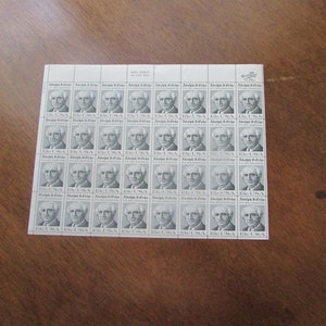 May include: A sheet of 36 vintage United States postage stamps featuring a black and white portrait of Adolph S. Ochs, the publisher of The New York Times. The stamps are arranged in a 6x6 grid and each stamp has the text "13c USA" and "Adolph S. Ochs PUBLISHER".