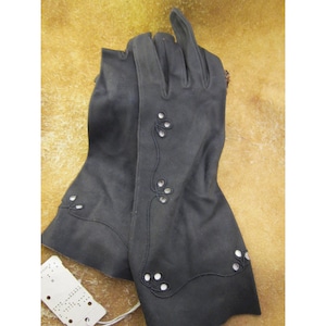 May include: A pair of black long gloves with a floral design and small white accents.