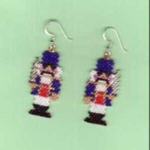 May include: Pair of blue and white beaded nutcracker earrings with silver hooks.