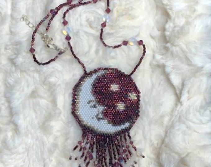 Metallic Purple Background Hosts a Smiling Crescent Moon