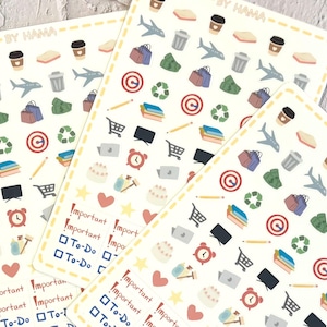 May include: Three sticker sheets with various colorful illustrations, including coffee cups, airplanes, shopping bags, and recycling symbols. The sheets also feature text that says "Important" and "To-Do". The brand name "BY HAMA" is printed at the top.