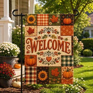 May include: A rectangular garden flag featuring a patchwork design with autumn motifs including orange pumpkins, yellow sunflowers, and red maple leaves. The word WELCOME is printed in large, bold, orange letters across the center.