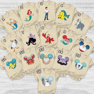 May include: A white ceramic mug with a black handle and the text "But First, Coffee" in a black, bold font. The mug is likely 4 inches tall and holds approximately 12 ounces of liquid. The mug is on a white surface.