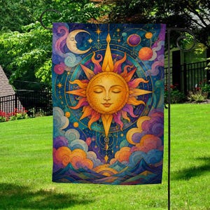 May include: A rectangular garden flag featuring a central golden sun with a serene face, surrounded by stylized rays, a crescent moon, colorful swirling clouds, and celestial bodies against a deep blue background with mountain silhouettes.