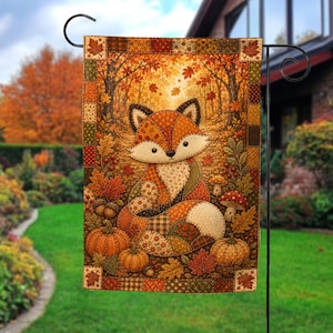 May include: A rectangular garden flag featuring a patchwork-style illustration of a fox sitting in an autumn forest. The design includes orange pumpkins, mushrooms, and falling maple leaves, all framed by a decorative border of small fabric squares.
