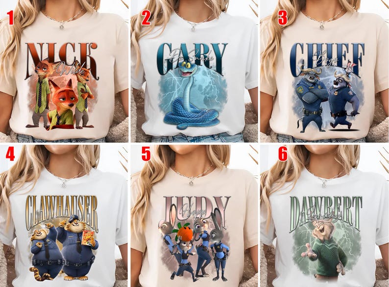 May include: A collection of six t-shirts featuring characters from the animated movie "Zootopia." Each shirt displays a character's name in a stylized font, accompanied by a graphic of the character. The shirts are in various colors, including white and beige.