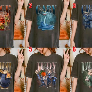 May include: A white ceramic mug with a black handle and the text "But First, Coffee" in a black, handwritten-style font. The mug is on a white surface.