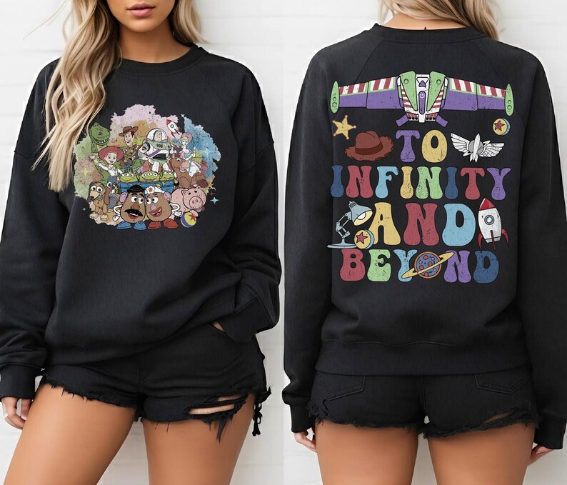 May include: Black sweatshirt featuring a colorful graphic of characters from a popular animated movie on the front. The back of the sweatshirt displays the text "TO INFINITY AND BEYOND" with related imagery. A fun and nostalgic apparel item.