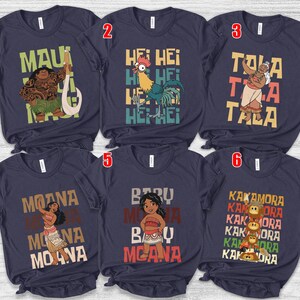 May include: Navy blue t-shirts featuring characters and text from the animated film "Moana." Designs include Maui with a hook, Hei Hei the rooster, Tala, Moana, Baby Moana, and the Kakamora. Each shirt has a unique graphic and text.