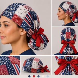 May include: A scrub cap featuring a patchwork design of red, white, and blue fabric patterns including stars, stripes, and floral motifs. The cap includes a gathered back section secured with a solid red ribbon tied into a decorative bow.