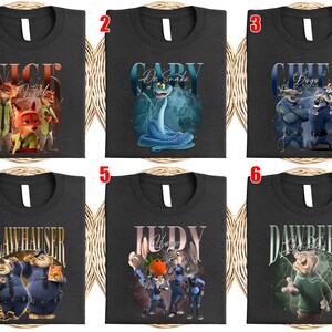 May include: Six black t-shirts with different character designs from the movie Zootopia. The designs include Nick Wilde, Gary the snake, Chief Bogo, Clawhauser, Judy Hopps, and Dawbert. Each shirt features a unique graphic and character name.