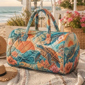 May include: A quilted duffel bag with a vibrant ocean-themed design. The bag features a turtle, coral, and sunset imagery in shades of blue, orange, and teal. It has two handles and a zipper closure. The bag is approximately 12 inches in height and 20 inches in length.