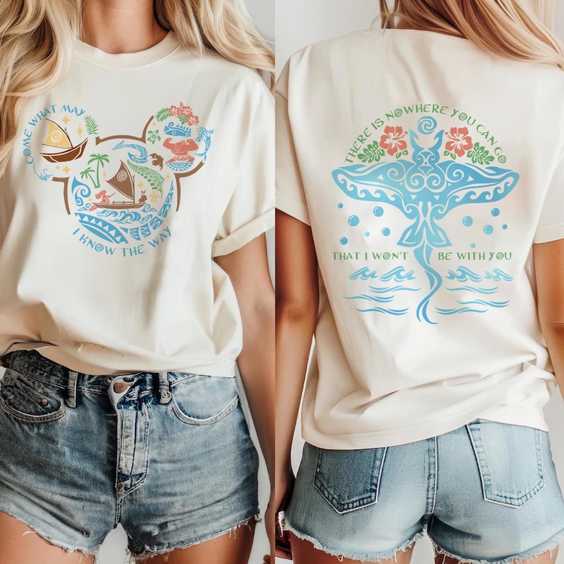 May include: Cream-colored t-shirt with a Mickey Mouse-shaped design featuring a boat, palm trees, and the text "COME WHAT MAY I KNOW THE WAY." The back of the shirt displays a blue manta ray design with the text "THERE IS NOWHERE YOU CAN GO THAT I WON'T BE WITH YOU."