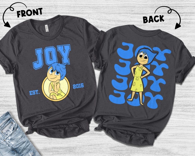 May include: Dark gray t-shirts featuring the character Joy from the movie Inside Out. The front of the shirt has the word "JOY" in blue block letters, the character Joy, and the text "EST. 2015". The back of the shirt has a graphic of Joy.