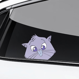 May include: A light purple cat sticker peeking out from behind a car window. The cat has large eyes, a small nose, and whiskers. The sticker is likely for car decoration.