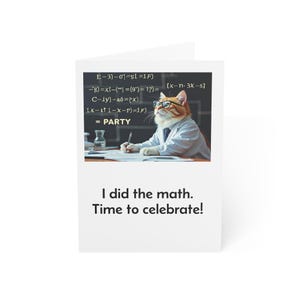 May include: White greeting card featuring a cat dressed as a professor, wearing glasses and a tie, writing on paper. The card includes mathematical equations and the text "I did the math. Time to celebrate!"