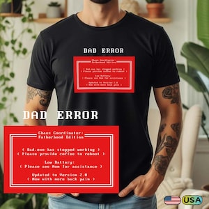 May include: Black t-shirt featuring the text "DAD ERROR" in white. A red rectangle on the shirt contains humorous text about a "Chaos Coordinator: Fatherhood Edition" and error messages. A small "USA" flag is visible.