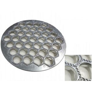 May include: A silver metal round mold with 36 individual round indentations for making dumplings. The mold has a textured rim.