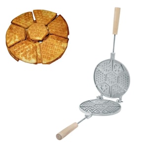May include: A silver waffle iron with a wooden handle. The iron is open, revealing a snowflake-shaped waffle design. A plate of six snowflake-shaped waffles is shown in the background.