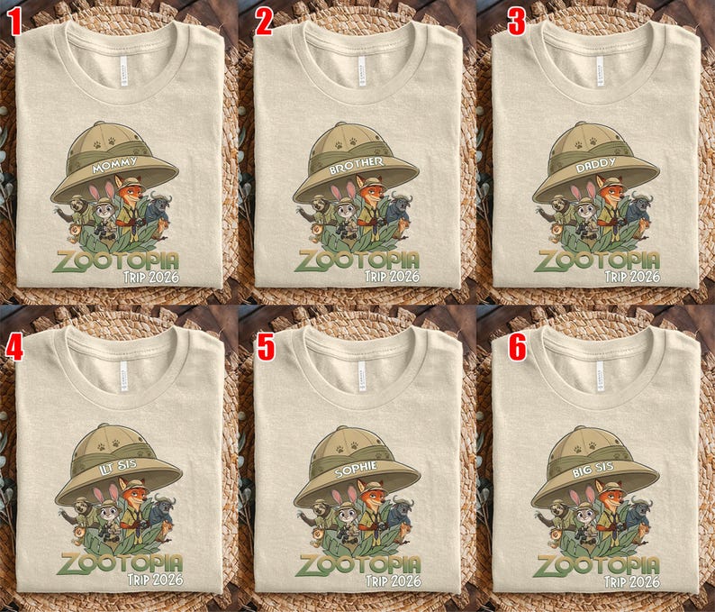 May include: Beige t-shirts with a Zootopia graphic featuring characters from the movie, a safari hat, and the text "ZOOTOPIA TRIP 2026". Each shirt has a different label on the hat: "MOMMY", "BROTHER", "DADDY", "LIL SIS", "SOPHIE", and "BIG SIS".