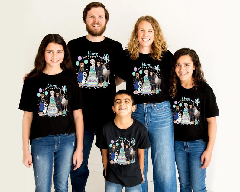 May include: A family wearing matching black t-shirts with a colourful graphic featuring characters from a popular animated film. The shirts have the text "Name" and the number "40" above the graphic. The people are wearing blue jeans.