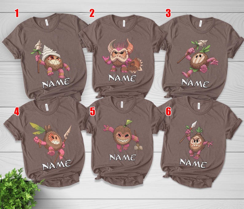 Puede incluir: Camisetas marrones con personajes de dibujos animados de coco en varias poses. Cada camiseta presenta un dise&ntilde;o de personaje diferente, con la palabra "NAME" impresa debajo. Las camisetas son de manga corta.