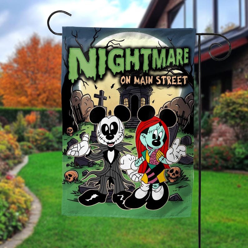 May include: A green and black garden flag featuring a Halloween-themed design. The flag displays the text "NIGHTMARE ON MAIN STREET" above cartoon characters in a graveyard setting. The characters are Mickey and Minnie Mouse, dressed in Halloween costumes.