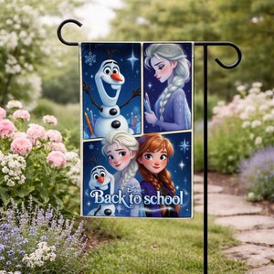 May include: A garden flag featuring a collage of images from the Disney movie Frozen. The flag includes images of Olaf the snowman, Elsa, and Anna, with the text "Back to school". The background is a dark blue with stars.