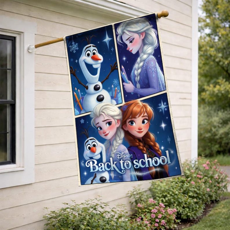 May include: A rectangular outdoor flag featuring characters from the Disney movie Frozen. The flag has a dark blue background with images of Olaf, Elsa, and Anna. The text "Back to school" is also visible on the flag.