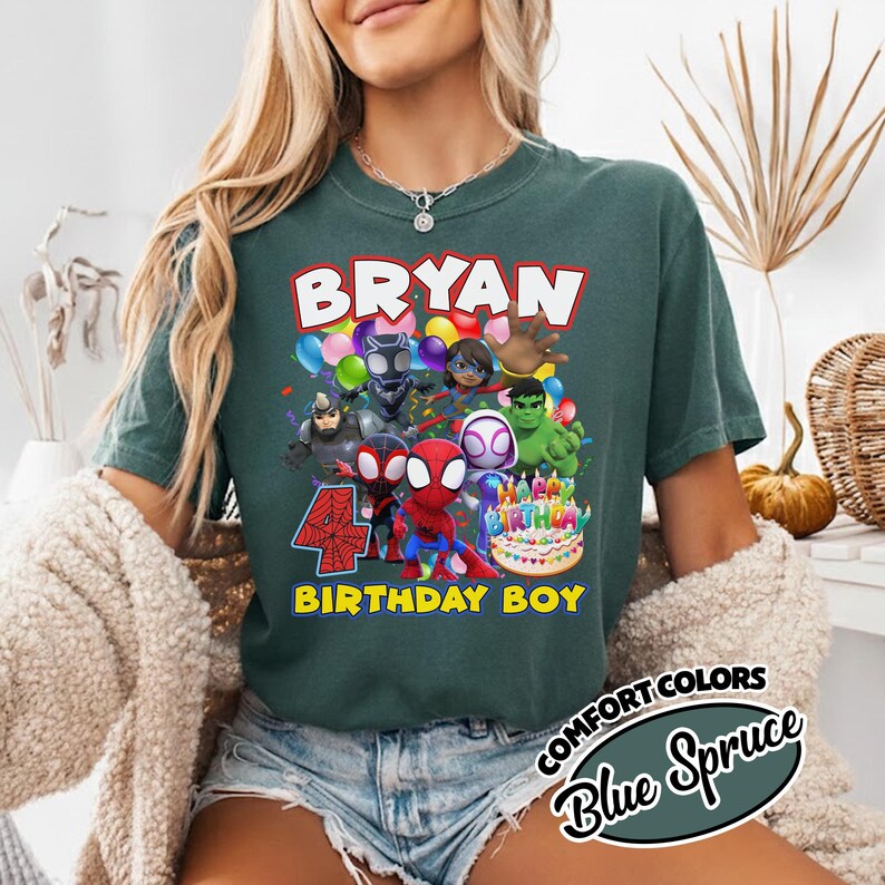 May include: A dark green t-shirt featuring a graphic print of various superhero characters, colorful balloons, and a birthday cake. The text reads BRYAN, 4, and BIRTHDAY BOY. The shirt has a crew neckline and short sleeves, showcasing a casual design.