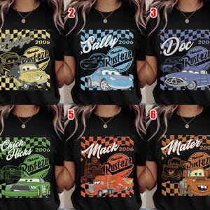 May include: Black t-shirts featuring characters from the movie Cars. Each shirt has a different character's name, the year 2006, and the Rusteze logo. Characters include Luigi, Sally, Doc, Chick Hicks, Mack, and Mater.