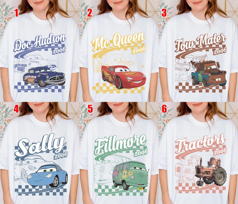 May include: A white t-shirt featuring six distinct designs of characters from the movie Cars, including Doc Hudson, Mc Queen, Tow Mater, Sally, Fillmore, and Tractors, each with their name, the year 2006, and a checkered pattern background.