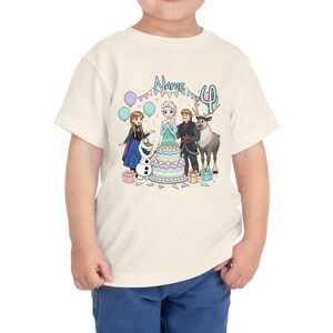 May include: A cream-colored toddler t-shirt featuring a colorful graphic of characters from the movie Frozen. The design includes a birthday cake, balloons, and the number 4. The word "Name" is also displayed.