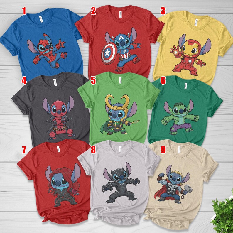 May include: A collection of nine short-sleeved t-shirts featuring cartoon character designs. Each shirt has a different color and a graphic of a character dressed as a superhero, including Spider-Man, Captain America, Iron Man, Deadpool, Loki, Hulk, Black Widow, Black Panther, and Thor.