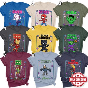 May include: Nine brightly coloured t-shirts, each showcasing a different Marvel character. The shirts feature superheroes and villains such as Gwen, Spidey, Hulk, Iron Man, Black Panther, Green Goblin, Doc Ock, Rhino, and Ms. Marvel, with their names above.