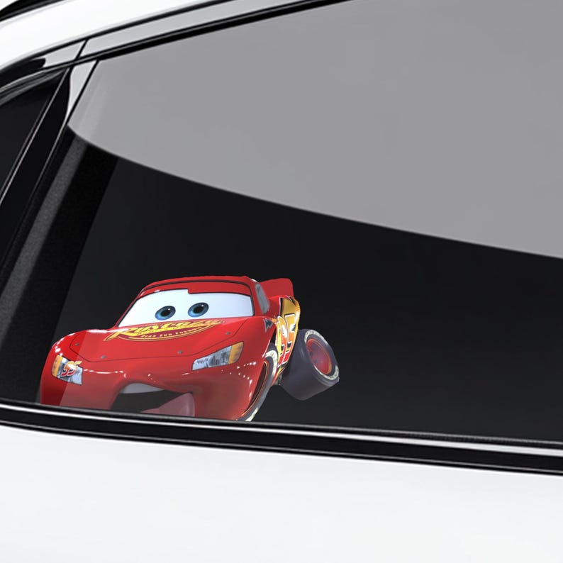 May include: A red Lightning McQueen car sticker with the word "Rust-eze" on the hood. The sticker is a cartoon image of the character from the movie Cars. The car is positioned as if it is driving.