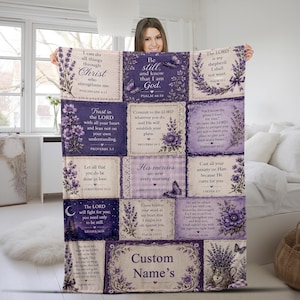 May include: A rectangular throw blanket featuring a grid of purple and cream panels with lavender floral illustrations, butterflies, and various Bible verses. The center bottom panel includes the text Custom Name's in a dark purple font.